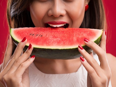 Woman eating Watermelon