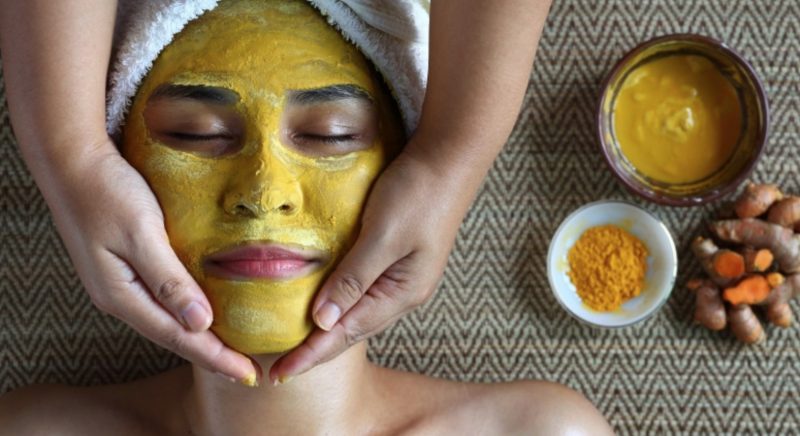 Woman with Tumeric Face Mask