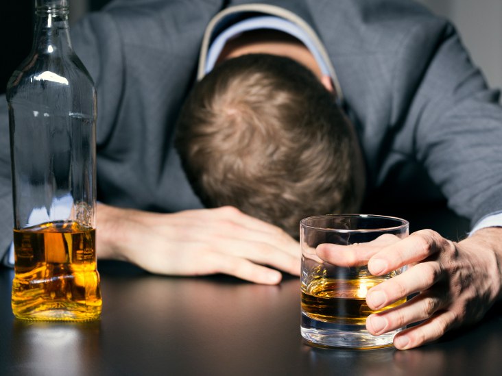 man-with-alcohol-in-hand-and-resting-head-on-table-732x549-thumb_0